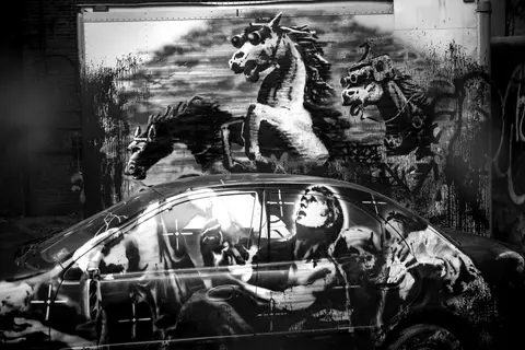 Dystopian horse mural black car street art