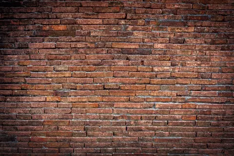Brazowy mur z cegly w stylu grunge